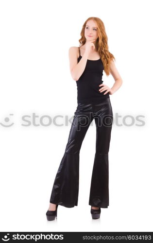 Redhead woman in black bell bottom pants on white