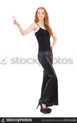 Redhead woman in black bell bottom pants on white