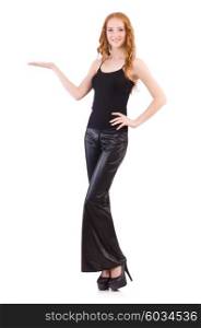 Redhead woman in black bell bottom pants on white