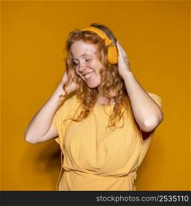 redhead woman listening music