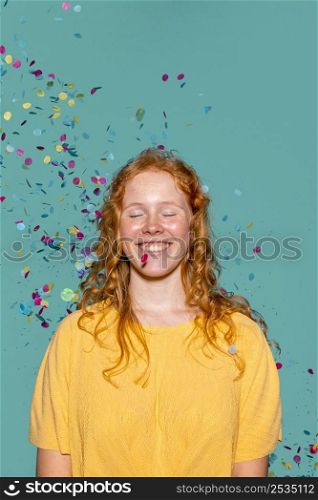 redhead woman partying with confetti