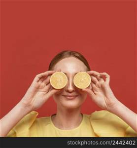 redhead woman posing with lemons 2