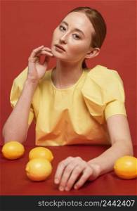 redhead woman posing with lemons