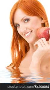 redhead woman with red apple in water