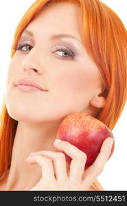 redhead woman with red apple over white