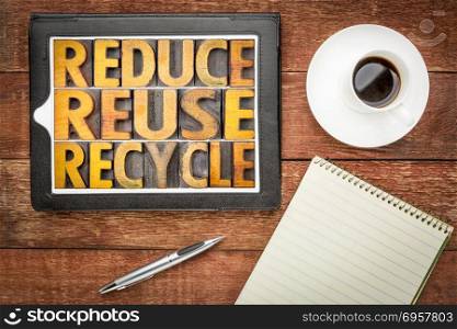reduce, reuse and recycle - resource conservation. reduce, reuse and recycle - isolated word abstract in vintage wooden letterpress type blocks on a digital tablet, resource conservation concept