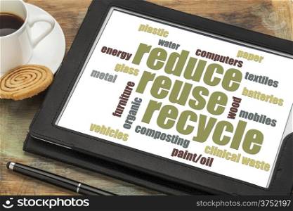 reduse, reuse, recycle word cloud on a digital tablet with a cup of coffee