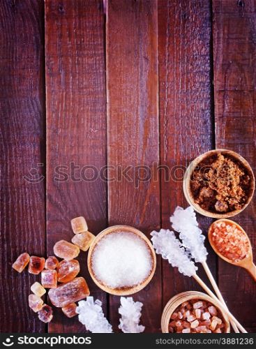 reed and white sugar on the wooden table