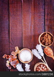 reed and white sugar on the wooden table