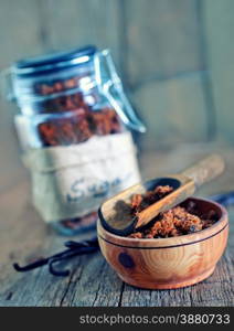 reed sugar in bowl and vanilla on a table