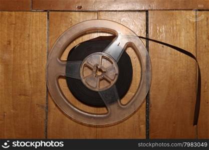 reel for reel tape player and recorder on wooden background
