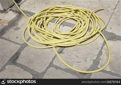 reel of yellow hose