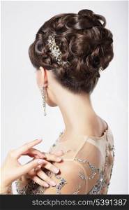 Refinement and Sophistication. Stylish Woman with Festive Coiffure