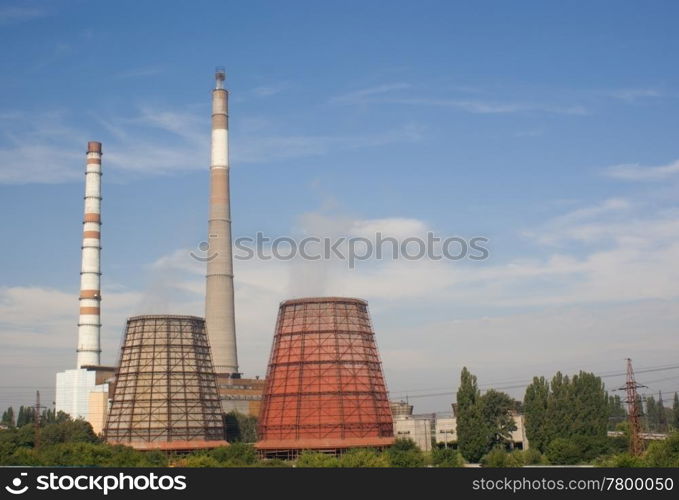 Refinery industrial pipes against blue sky