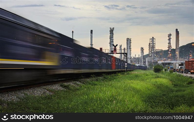 refinery oil and petroleum industry factory zone and containers cargo logistics train transportation open lighting movement foreground with background sky in the rain season Thailand