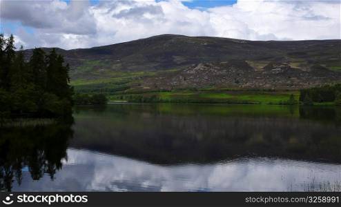 Reflecting lake, Scottish Highlands, Scotland UK.