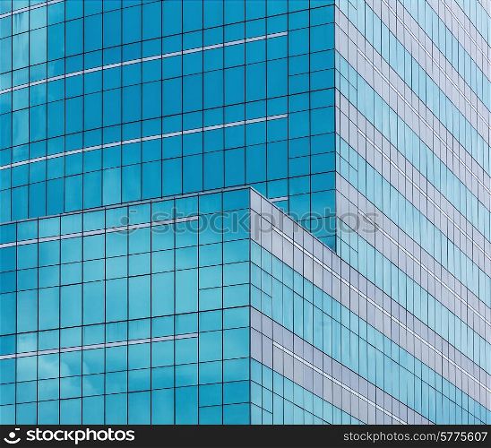 reflecting sky in glass of office building ;geometric abstract background