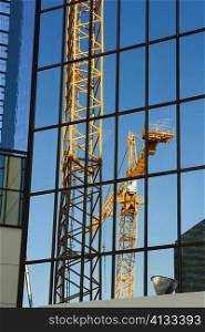 Reflection of a crane on a building, Miami, Florida, USA