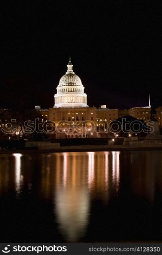 Reflection of a government building in water, Capitol building, Washington DC, USA