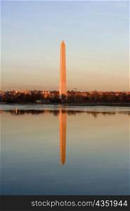 Reflection of a monument in water, Washington Monument, Washington DC, USA