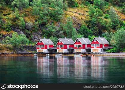 Reflection of a small houses in a fiord, Norway