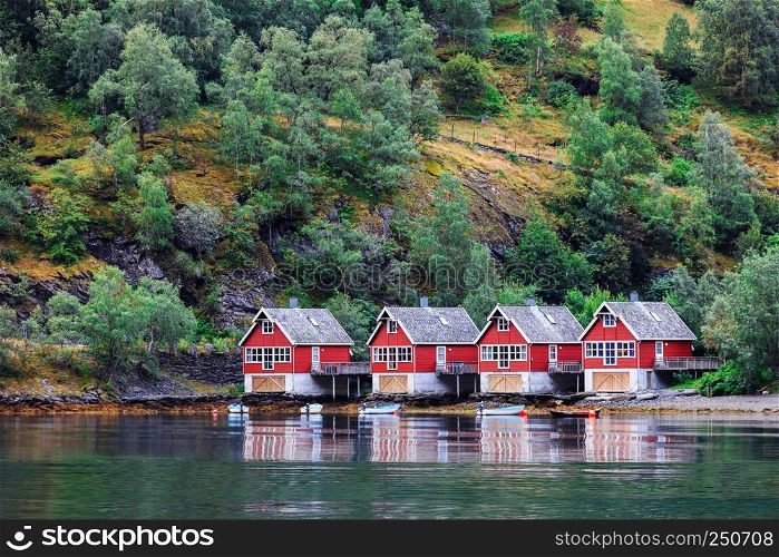 Reflection of a small houses in a norwegian fiord, Norway