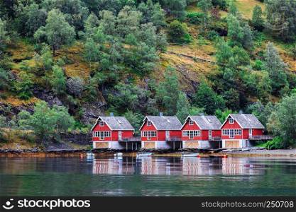 Reflection of a small houses in a norwegian fiord, Norway