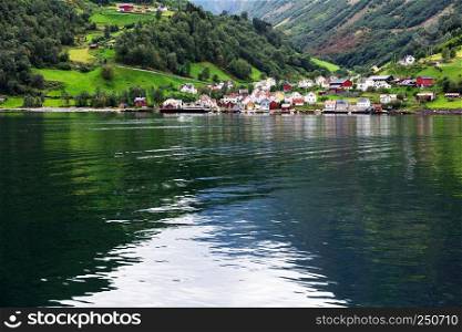 Reflection of a small town in a norwegian fiord, Norway
