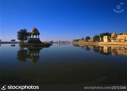 Reflection of a temple in a lake, Gadsisar Lake, Jaisalmer, Rajasthan, India