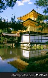 Reflection of a temple in water, Kinkaku-Ji Temple, Kyoto, Japan
