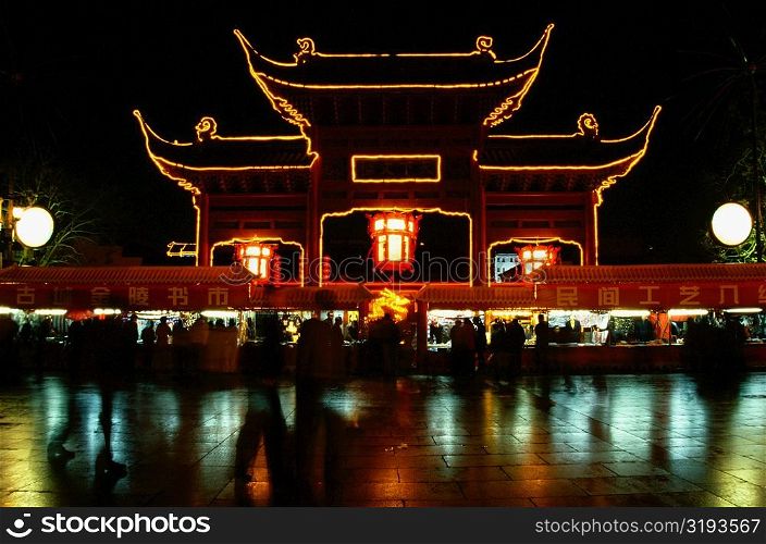Reflection of an illuminated temple in water, Nanjing, Jiangsu Province, China