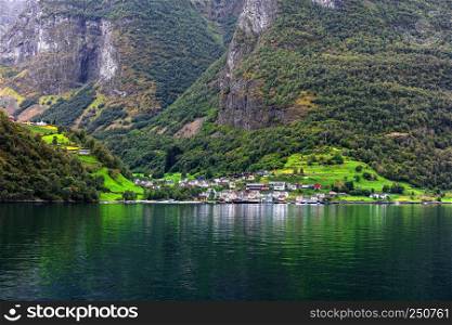 Reflection of asmall town in a norwegian fiord, Norway