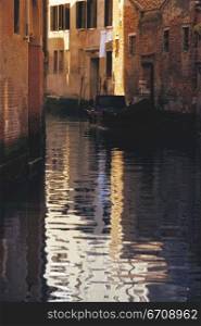 Reflection of buildings in canal, Venice, Italy