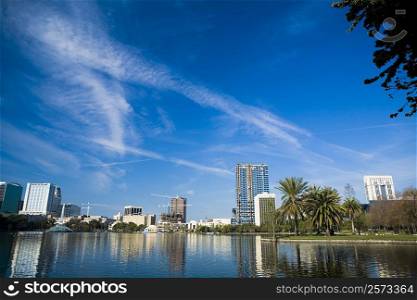 Reflection of buildings in water, Lake Eola, Orlando, Florida, USA