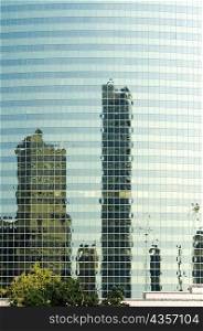 Reflection of buildings on the glass front of a building, Chicago, Illinois, USA