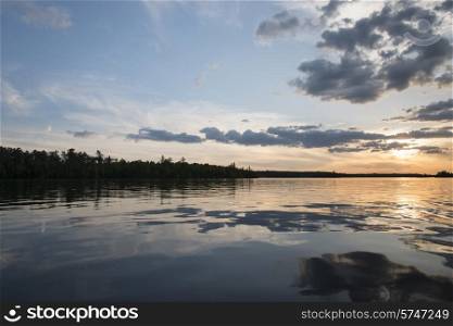 Reflection of clouds at sunset, Lake of The Woods, Ontario, Canada