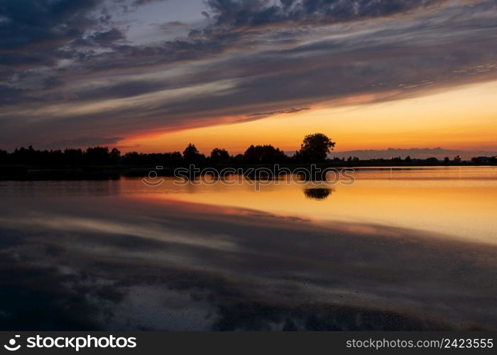 Reflection of clouds in the water after sunset, Stankow, Lubelskie, Poland