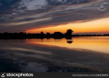 Reflection of clouds in the water after sunset, Stankow, Lubelskie, Poland