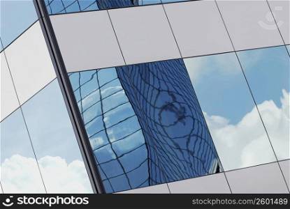 Reflection of clouds on the glass of a building