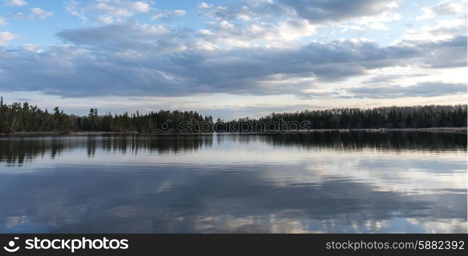 Reflection of clouds on water, Lake Of The Woods, Ontario, Canada