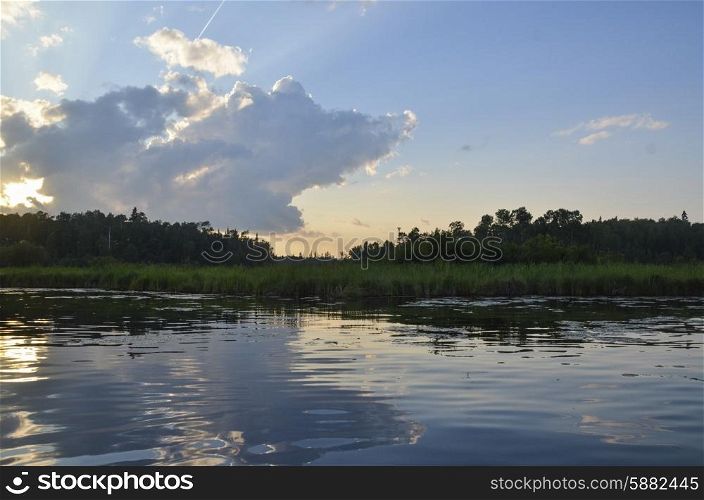 Reflection of clouds on water, Lake of the Woods, Ontario, Canada