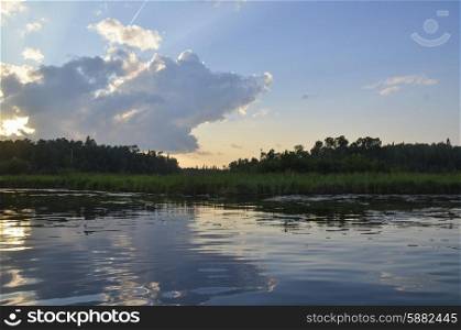 Reflection of clouds on water, Lake of the Woods, Ontario, Canada
