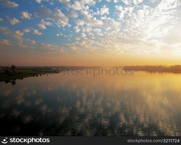 Reflection of clouds on water, Nile River, Egypt