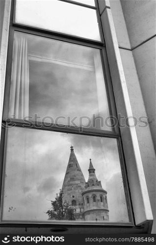 Reflection of Fishermen&rsquo;s Bastion in a window hotel in Budapest