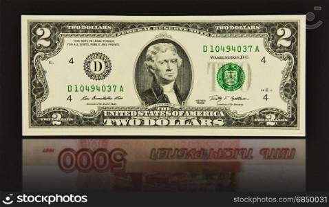 Reflection of five thousand Russian rubles banknote two dollars