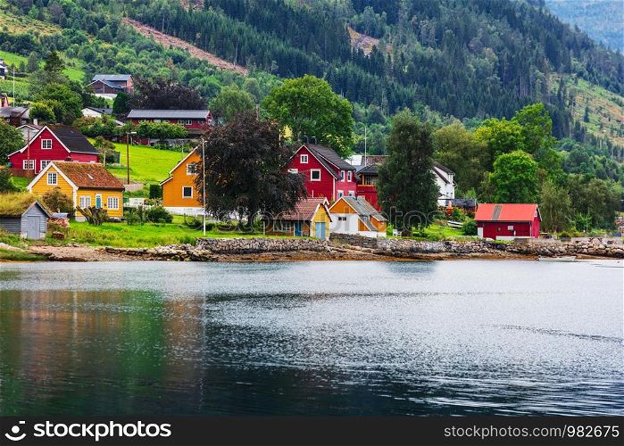 Reflection of houses in a norwegian fjord, Norway