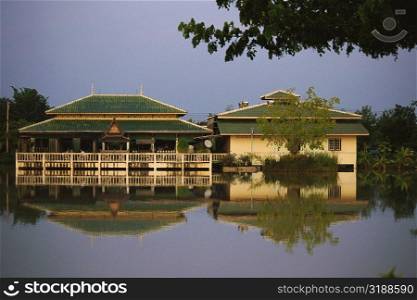 Reflection of inns in water, Sukhothai, Thailand