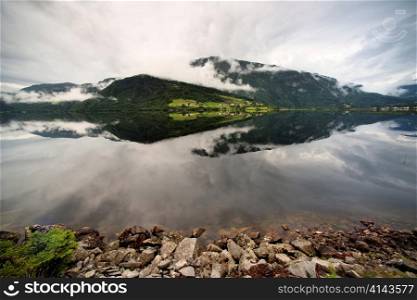 Reflection of mountains with clouds in the lake, Granvinsvatnet, Granvin, Hordaland County, Norway