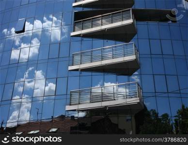Reflection of old hauses and sky in the modern glass huose in Belgrade,Serbia