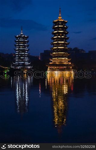 Reflection of pagodas in a lake, Sun And Moon Pagoda, Banyan Lake, Guilin, Guangxi Province, China